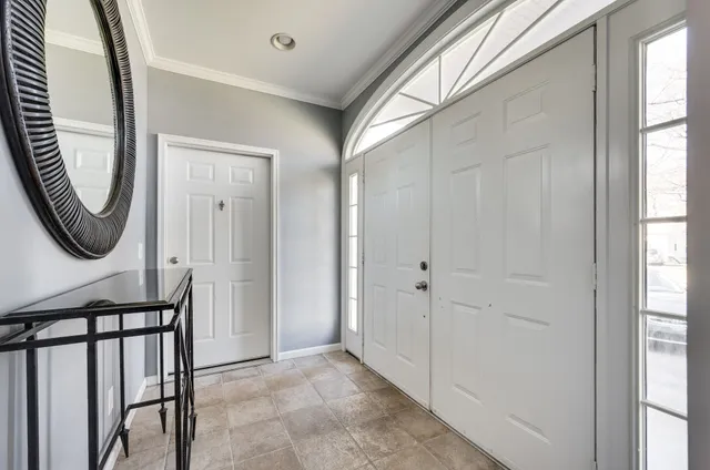 a view of a hallway with painted walls and stairs