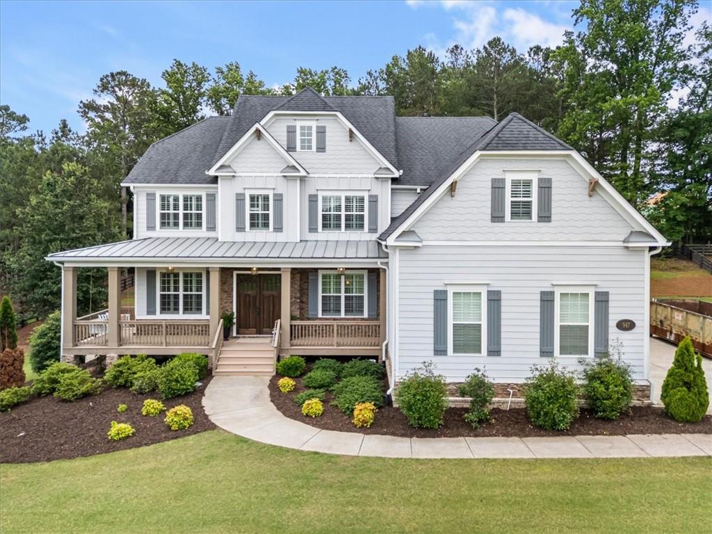 947 Hunter Way Milton, GA 30004 - Photo 7 of 78 a front view of a house with a yard