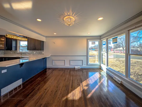 a view of kitchen with sink and wooden floor