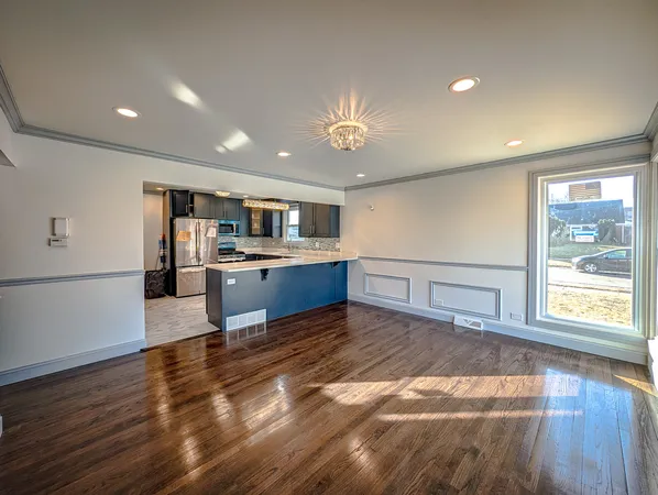 a view of kitchen with cabinets and wooden floor