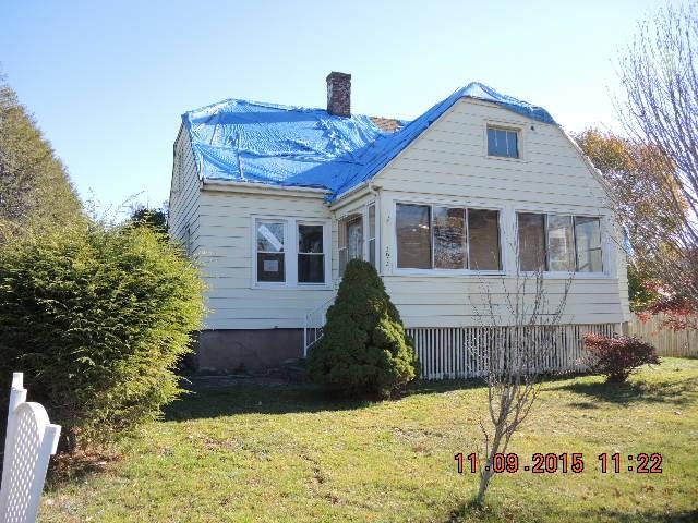 393 Slater Road New Britain, CT 06053 - Photo 1 of 1 a front view of a house with a yard