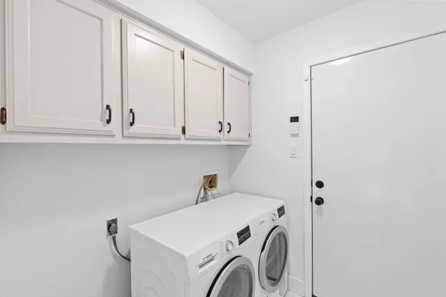 a view of cabinets and washer