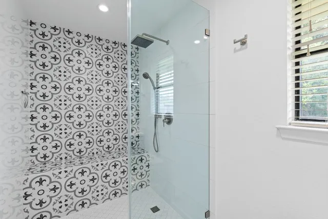 a bathroom with a shower curtain and a sink