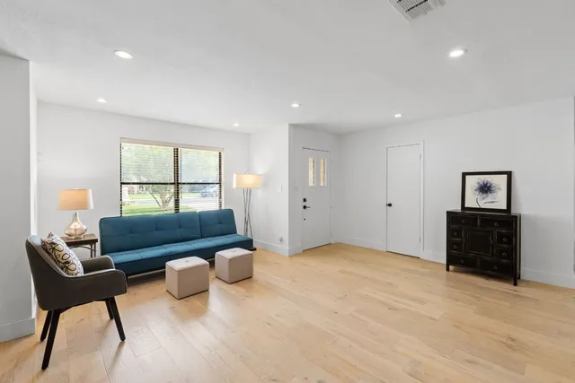 a living room with furniture and a window