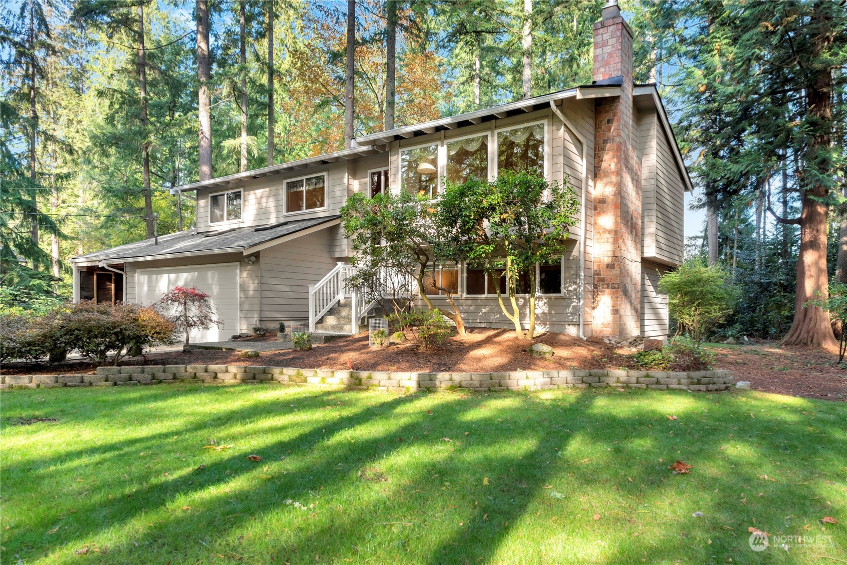 22215 49th Avenue Southeast Bothell, WA 98021 - Photo 1 of 35 a front view of a house with a yard