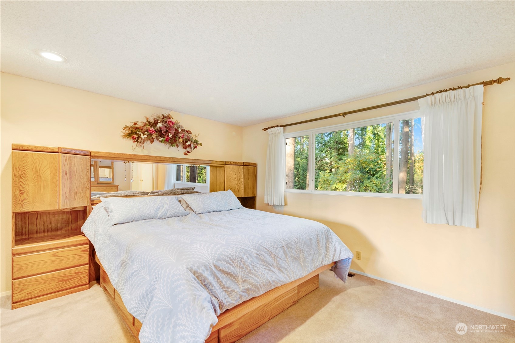 22215 49th Avenue Southeast Bothell, WA 98021 - Photo 12 of 35 a bedroom with a large bed and a window