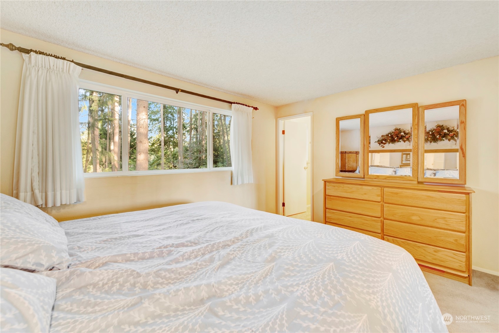 22215 49th Avenue Southeast Bothell, WA 98021 - Photo 13 of 35 a bedroom with a bed and wooden floor