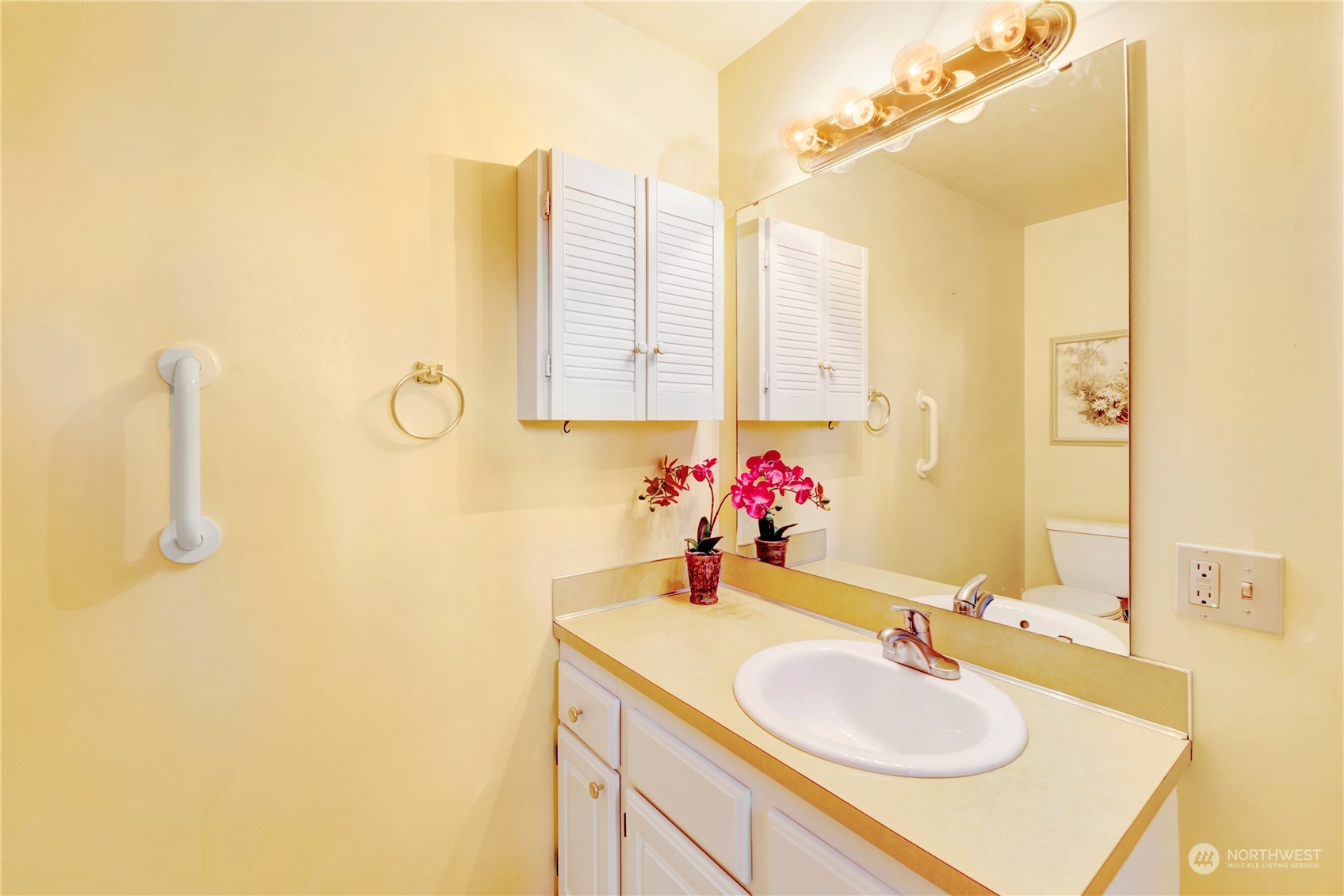 22215 49th Avenue Southeast Bothell, WA 98021 - Photo 16 of 35 a bathroom with a sink vanity and a mirror