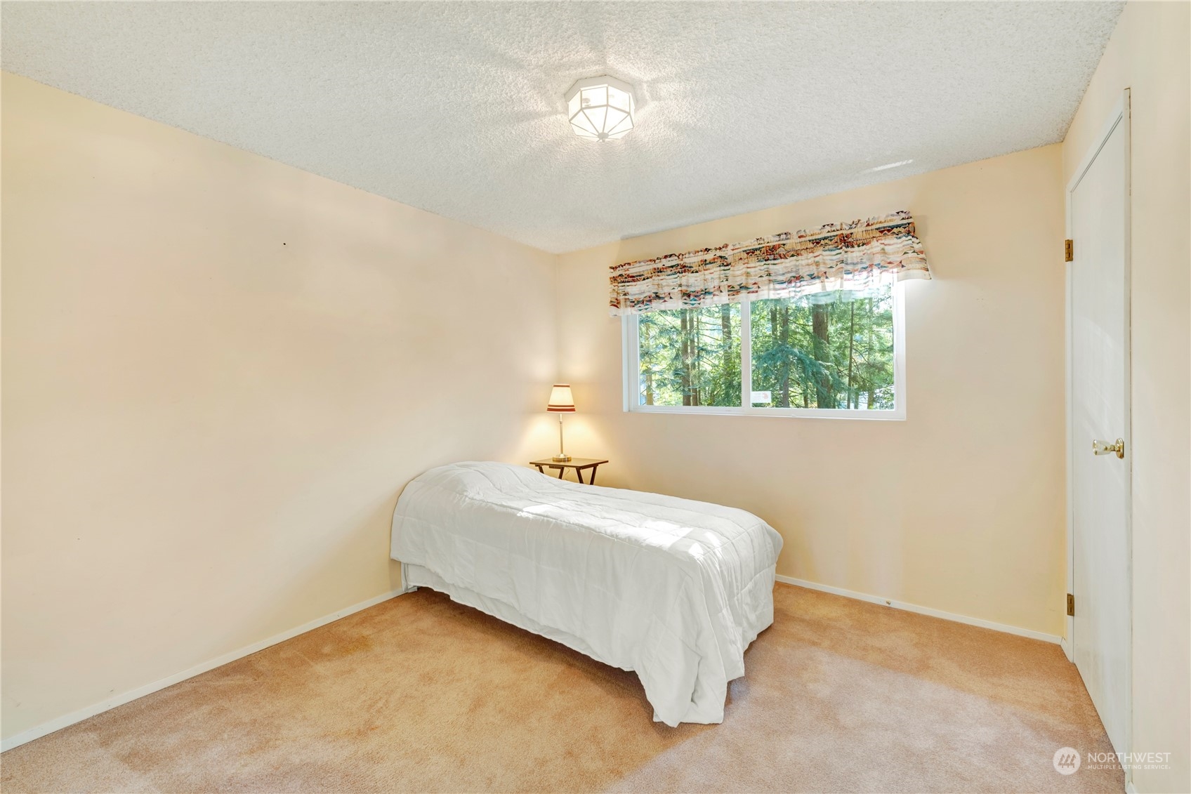 22215 49th Avenue Southeast Bothell, WA 98021 - Photo 18 of 35 a bedroom with a bed and a window