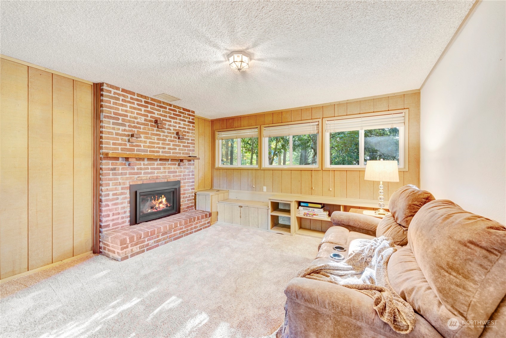 22215 49th Avenue Southeast Bothell, WA 98021 - Photo 24 of 35 a living room with furniture and a fireplace
