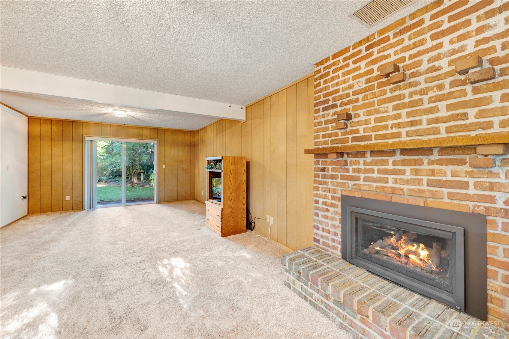22215 49th Avenue Southeast Bothell, WA 98021 - Photo 25 of 35 a view of an empty room with a fireplace and a window