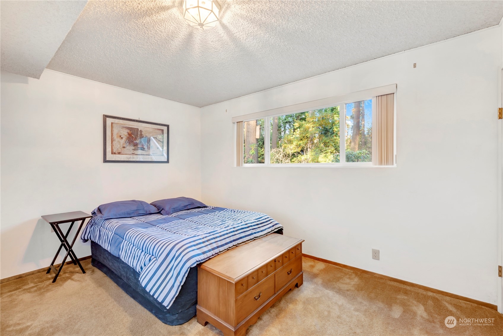 22215 49th Avenue Southeast Bothell, WA 98021 - Photo 27 of 35 a bedroom with a bed and a window