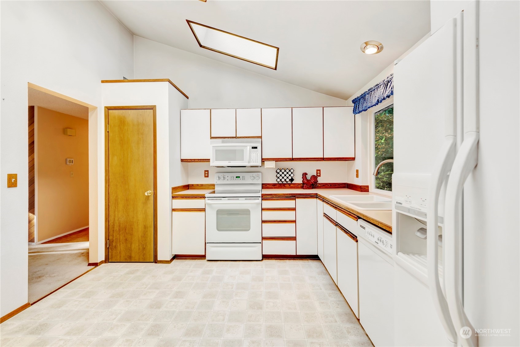 22215 49th Avenue Southeast Bothell, WA 98021 - Photo 10 of 35 a kitchen with white cabinets and white appliances