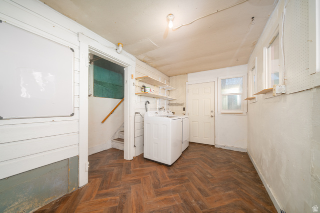 757 North 500 East Logan, UT 84321 - Photo 8 of 15 Laundry area featuring washing machine and dryer and parquet flooring