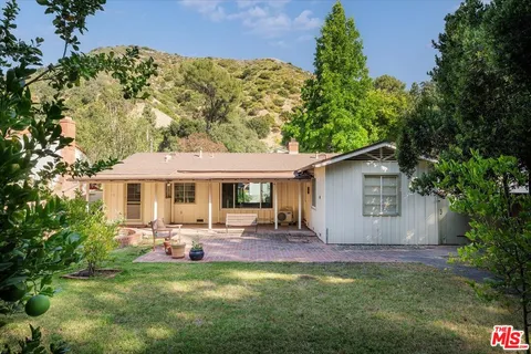 a view of a back yard of the house