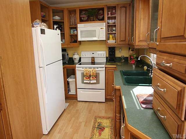 Beautifully updated kitchen with new cabinets, counter tops, sink and faucets and under cabinet lighting.