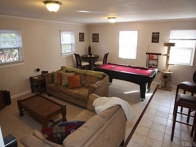 Large family room perfect for watching the newest release movie or playing a friendly game of pool.