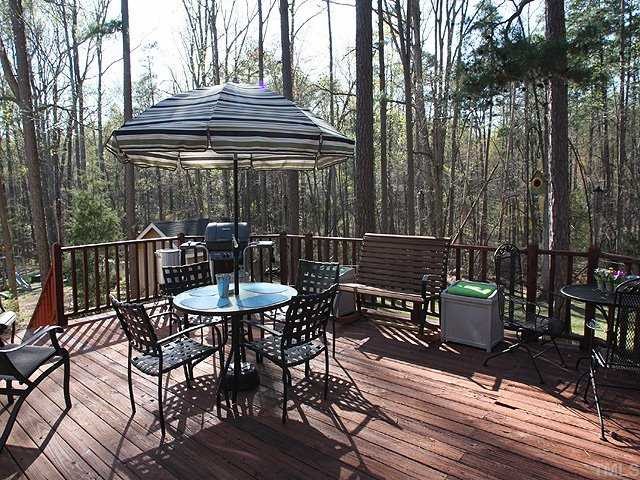 7933 Brandyapple Drive Raleigh, NC 27615 - Photo 9 of 12 Huge deck overlooks the private backyard. Perect place to unwind at the end of the day.