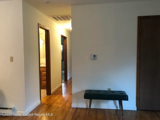 a view of a room with furniture and a potted plant