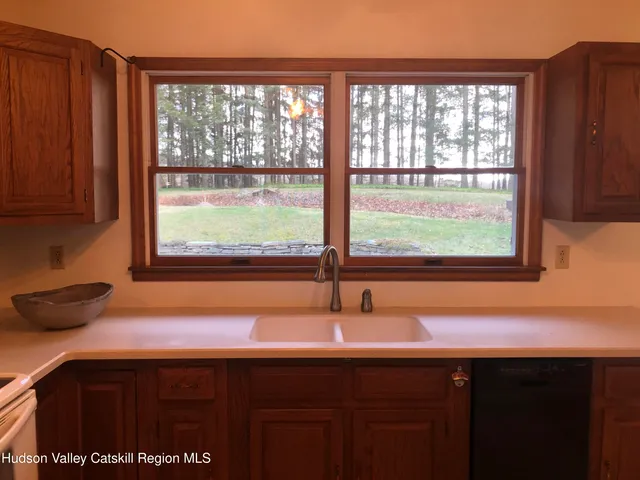 a kitchen with a sink and a window