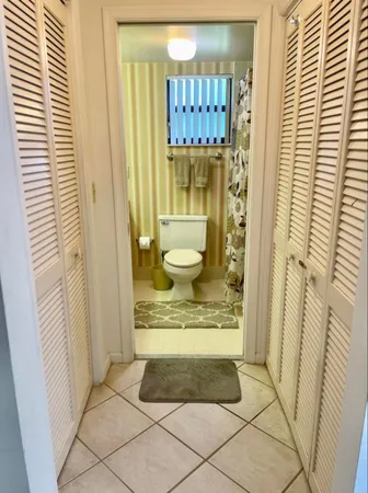 a bathroom with a granite countertop shower and a sink