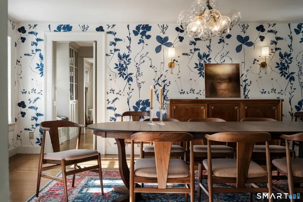 a view of a dining room with furniture and wooden floor