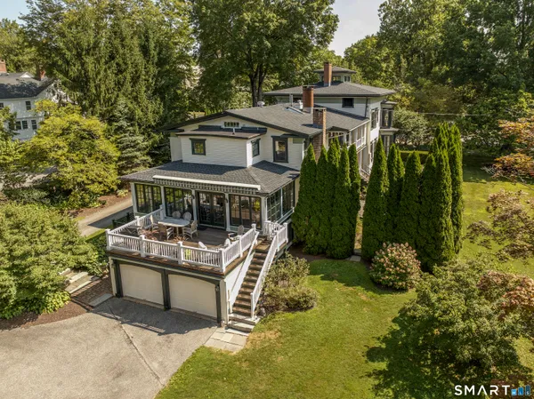 aerial view of a house with a yard