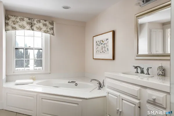 a bathroom with a sink and a window