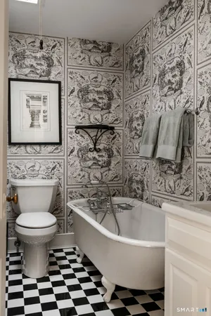 a bathroom with a bathtub and a toilet