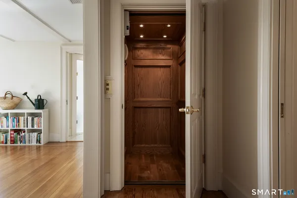 a view of a bedroom from a hallway
