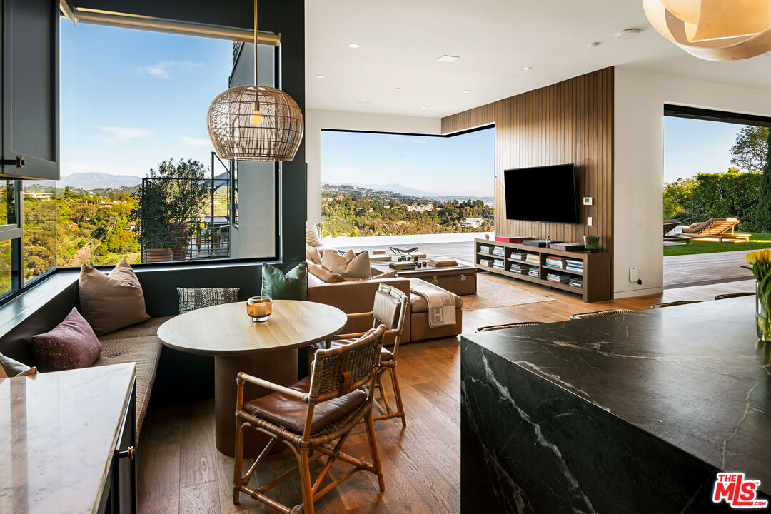 1030 Somera Road Los Angeles, CA 90077 - Photo 11 of 54 a living room with furniture and a flat screen tv
