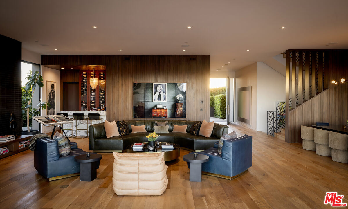 1030 Somera Road Los Angeles, CA 90077 - Photo 15 of 54 a living room with furniture and wooden floor