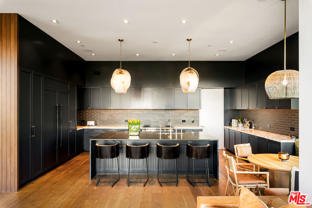 1030 Somera Road Los Angeles, CA 90077 - Photo 24 of 54 a kitchen with a table and chairs in it