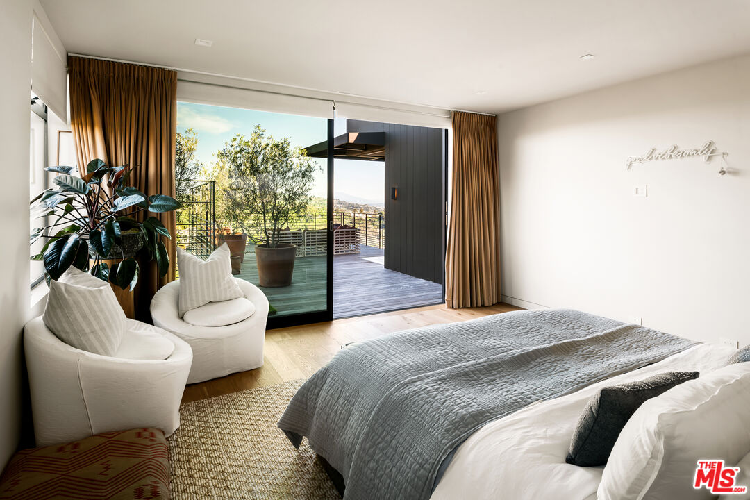 1030 Somera Road Los Angeles, CA 90077 - Photo 38 of 54 a bedroom with a bed and a couch