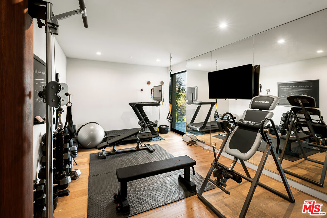 1030 Somera Road Los Angeles, CA 90077 - Photo 43 of 54 a view of a room with gym equipment