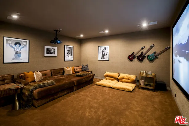 a view of a balcony with two chairs and a potted plant