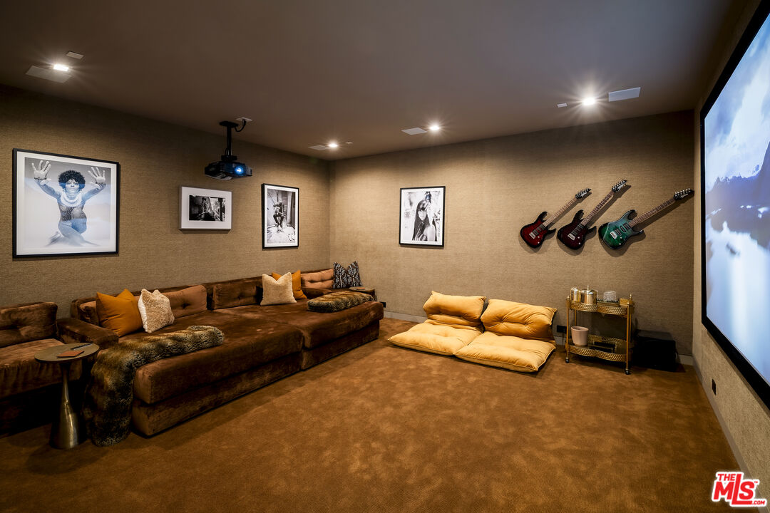 1030 Somera Road Los Angeles, CA 90077 - Photo 44 of 54 a living room with furniture and a flat screen tv