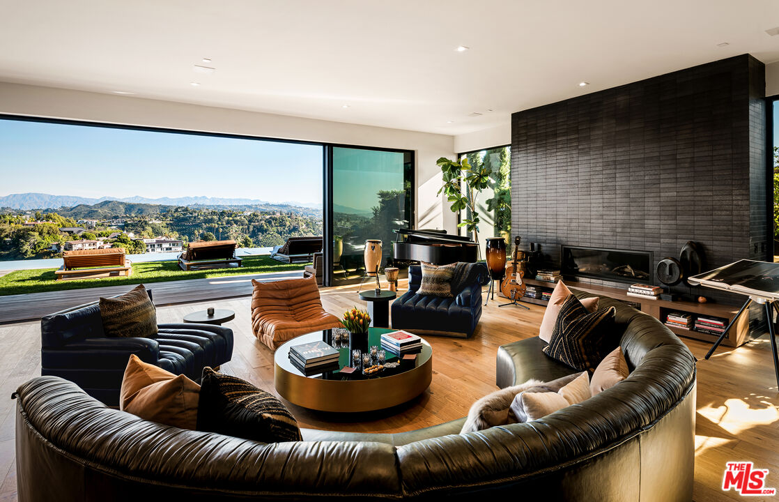 1030 Somera Road Los Angeles, CA 90077 - Photo 6 of 54 a living room with furniture and a flat screen tv