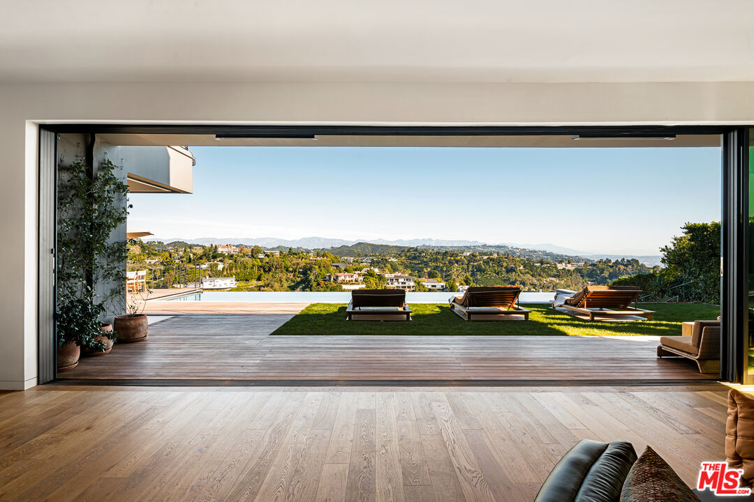 1030 Somera Road Los Angeles, CA 90077 - Photo 7 of 54 a view of swimming pool with an outdoor seating