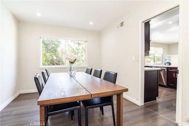 a view of a dining room with furniture and window