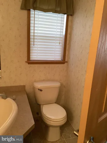 a bathroom with a toilet and a sink