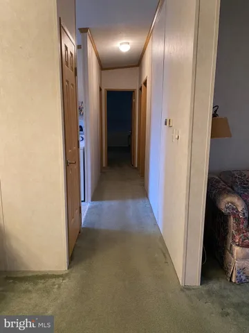 a view of a hallway with closet