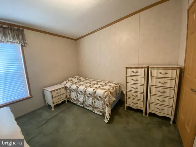 a bedroom with a bed and a cabinets