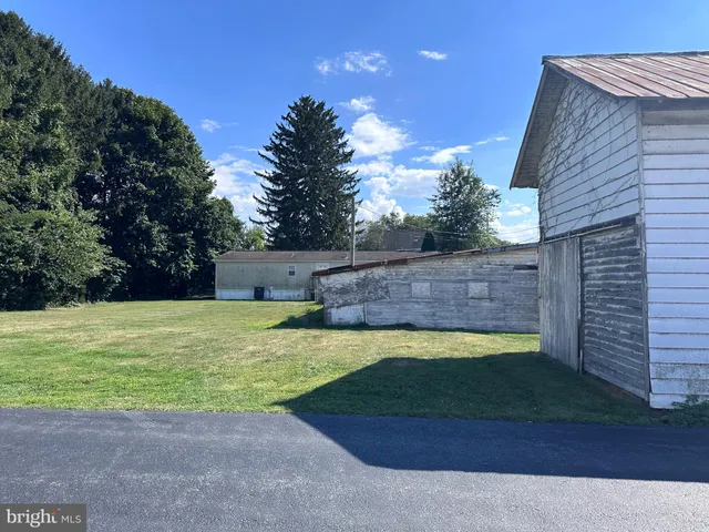 a view of a swimming pool with a yard