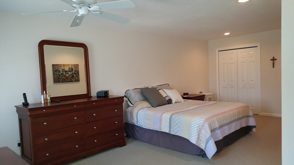 5 Hazen Road Shirley, MA 01464 - Photo 14 of 23 a bedroom with a bed and a mirror