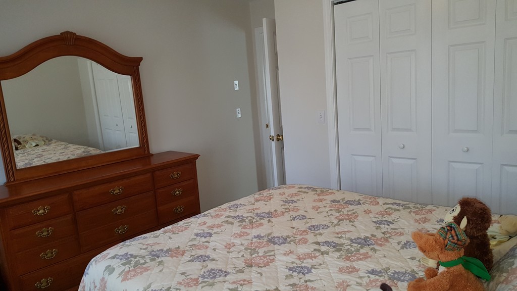 5 Hazen Road Shirley, MA 01464 - Photo 16 of 23 a bedroom with a bed and a dresser
