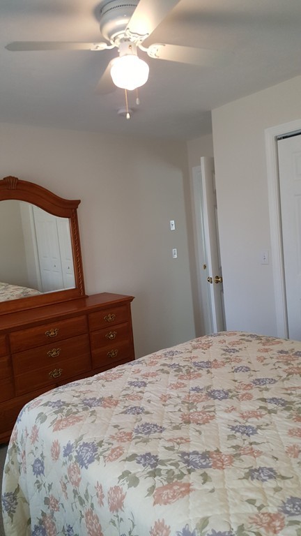 5 Hazen Road Shirley, MA 01464 - Photo 17 of 23 a bedroom with a bed and a dresser
