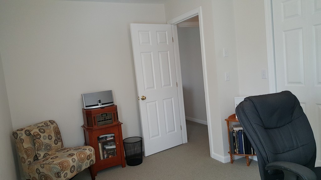5 Hazen Road Shirley, MA 01464 - Photo 19 of 23 a living room with furniture and a chair