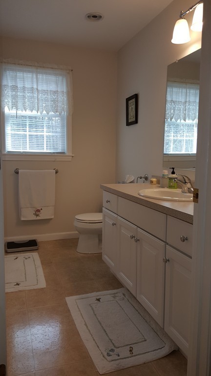 5 Hazen Road Shirley, MA 01464 - Photo 20 of 23 a bathroom with a sink toilet and window