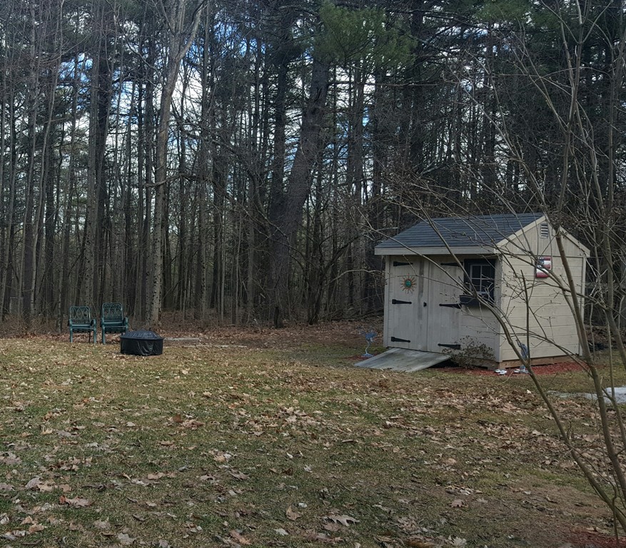 5 Hazen Road Shirley, MA 01464 - Photo 22 of 23 a view of a barn in the middle of a yard